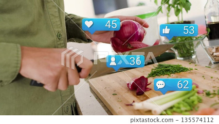 Slicing cook in green shirt chopping red onion on kitchen counter, with cutting board, social icons Slicing cook in green shirt chopping red onion on kitchen counter, with cutting board, social icons 135574112