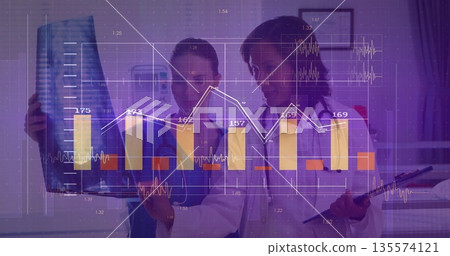 Two female doctors reviewing radiograph in clinic with financial chart overlay and stethoscope 135574121