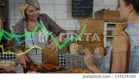 Serving bakery attendant wearing striped apron slicing pastries at wood counter, with data overlay Serving bakery attendant wearing striped apron slicing pastries at wood counter, with data overlay 135574160