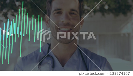 Smiling healthcare worker wearing blue scrubs and stethoscope in sunny garden with data overlay 135574167