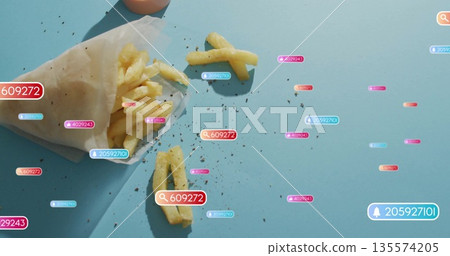 Presenting white parchment cone holding pepper-flecked fries on blue table, UI badges, copy space Presenting white parchment cone holding pepper-flecked fries on blue table, UI badges, copy space 135574205