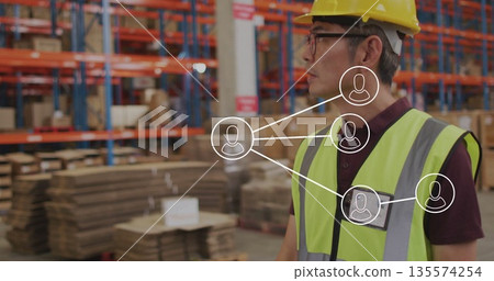 Highlighting network map over Korean worker wearing hard hat in warehouse with racks, copy space Highlighting network map over Korean worker wearing hard hat in warehouse with racks, copy space 135574254
