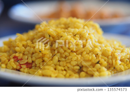 closeup of bulgur rice on a white plate  135574573