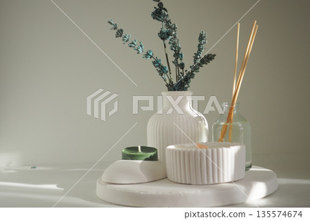 Decorative arrangement with plants and candles on table Decorative arrangement with plants and candles on table 135574674