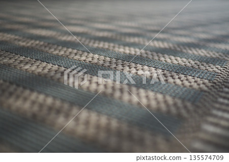 Close view of woven fabric surface with patterns and colors Close view of woven fabric surface with patterns and colors 135574709