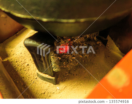 The charcoal flame remaining in the tea kettle in the tea room. The time when the water quietly breathes. Glowing Charcoal in Tea Room The charcoal flame remaining in the tea kettle in the tea room. The time when the water quietly breathes. Glowing Charcoal in Tea Room 135574916