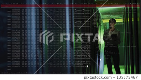 IT specialist wearing suit surveying racks in server room aisle, with hex code overlay, copy space IT specialist wearing suit surveying racks in server room aisle, with hex code overlay, copy space 135575467