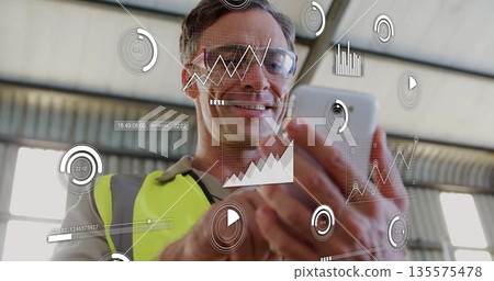 Checking engineer wearing hi-vis vest, glasses tapping phone screen in plant, with data overlays Checking engineer wearing hi-vis vest, glasses tapping phone screen in plant, with data overlays 135575478