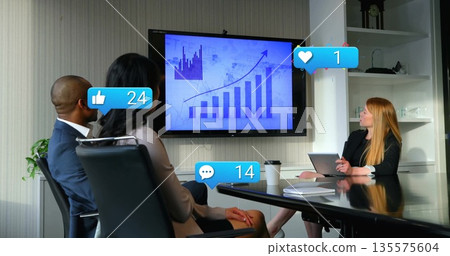 Business professionals analyzing bar chart with reaction icons in boardroom, with laptop Business professionals analyzing bar chart with reaction icons in boardroom, with laptop 135575604