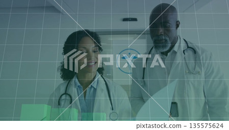 Doctors wearing lab coats analyzing grid overlay in clinic corridor, with green bar charts Doctors wearing lab coats analyzing grid overlay in clinic corridor, with green bar charts 135575624