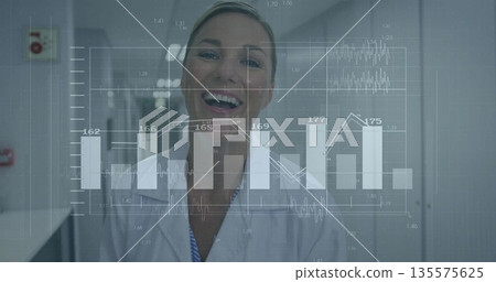 Smiling scientist in lab coat analyzing data in lab corridor, with translucent data interface Smiling scientist in lab coat analyzing data in lab corridor, with translucent data interface 135575625