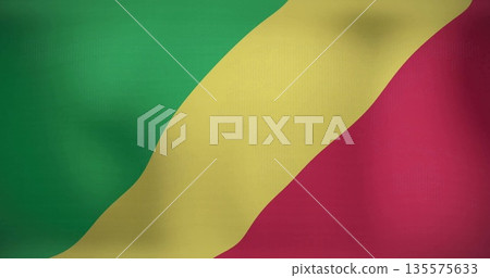 Displaying national flag of Congo waving on studio backdrop, with green yellow red diagonal stripes 135575633