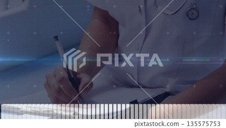 Writing female doctor filling notes on clipboard using black pen in clinic room, with stethoscope Writing female doctor filling notes on clipboard using black pen in clinic room, with stethoscope 135575753