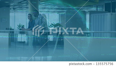 Leaning professionals in grey suit and blue blouse engaging in conversation in lobby, with railing Leaning professionals in grey suit and blue blouse engaging in conversation in lobby, with railing 135575756