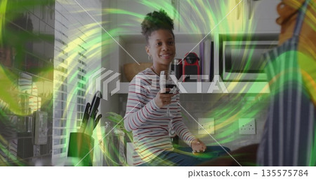 Sitting woman wearing striped shirt holding wine glass on kitchen countertop, with knife block Sitting woman wearing striped shirt holding wine glass on kitchen countertop, with knife block 135575784