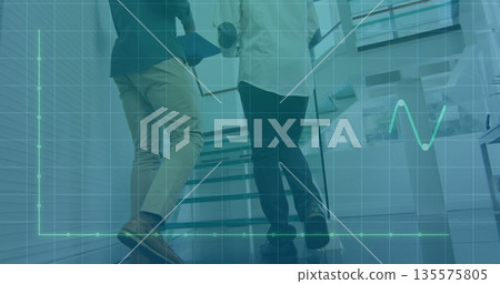 Climbing office stairs, colleagues in blazers holding portfolio and coffee with data-graph overlay 135575805