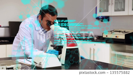 Peering scientist in lab coat examining sample through microscope in lab, with digital overlay Peering scientist in lab coat examining sample through microscope in lab, with digital overlay 135575882