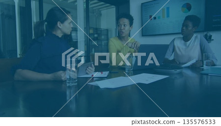 Discussing strategy business professionals analyzing charts at conference room, with tablet laptop Discussing strategy business professionals analyzing charts at conference room, with tablet laptop 135576533