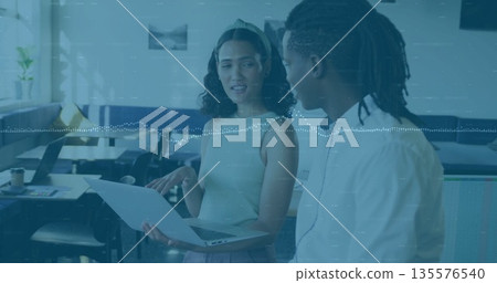 Pointing woman and listening man discussing project in modern office, with laptop and potted plant Pointing woman and listening man discussing project in modern office, with laptop and potted plant 135576540