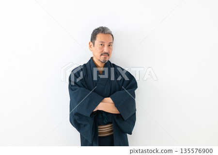 A man wearing a kimono A man wearing a kimono 135576900