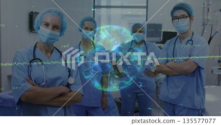 Standing medical team wearing scrubs and masks in operating room, with holographic globe overlay Standing medical team wearing scrubs and masks in operating room, with holographic globe overlay 135577077