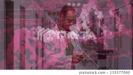 Mature doctor wearing coat using tablet in hospital hallway, with stethoscope and pink DNA helix Mature doctor wearing coat using tablet in hospital hallway, with stethoscope and pink DNA helix 135577080