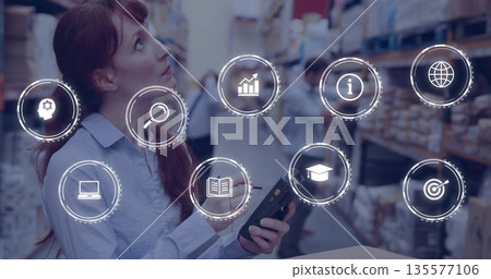 Holding clipboard and pen, warehouse supervisor checking inventory on aisle shelves, copy space Holding clipboard and pen, warehouse supervisor checking inventory on aisle shelves, copy space 135577106