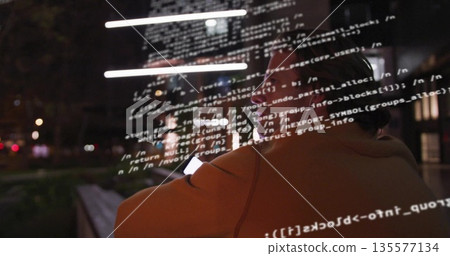 Scanning developer wearing jacket, eyeglasses, using smartphone code overlay on park bench at night Scanning developer wearing jacket, eyeglasses, using smartphone code overlay on park bench at night 135577134