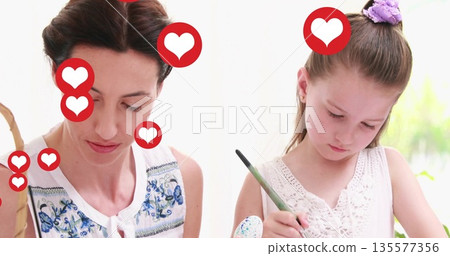 Painting mother and daughter creating speckled eggs at craft table near window, with paintbrushes Painting mother and daughter creating speckled eggs at craft table near window, with paintbrushes 135577356