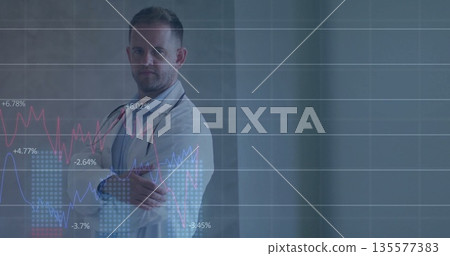 Displaying chart overlay, doctor crossing arms in clinic, with coat and stethoscope, copy space 135577383