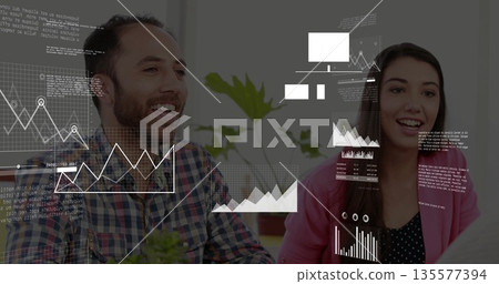 Leaning colleagues analyzing data charts in bright office, with potted plant and floating panels Leaning colleagues analyzing data charts in bright office, with potted plant and floating panels 135577394