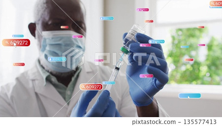 Drawing liquid from vaccine vial Dr Drawing liquid from vaccine vial Dr 135577413