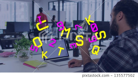 Office worker wearing plaid shirt checking smartphone at desk in office, with laptop, copy space Office worker wearing plaid shirt checking smartphone at desk in office, with laptop, copy space 135577502