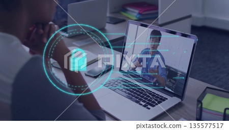 Showing man listening at office desk while laptop displaying padlock over secure call, copy space 135577517