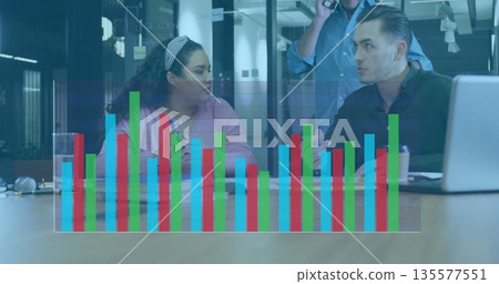 Professionals in business attire discussing data trends in office meeting, with notebook smartphone 135577551