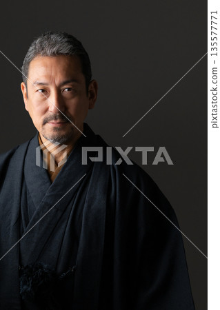 A man wearing a kimono A man wearing a kimono 135577771