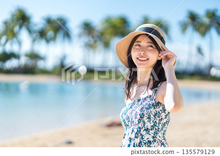 A young woman on vacation in a tropical country. A young woman on vacation in a tropical country. 135579129