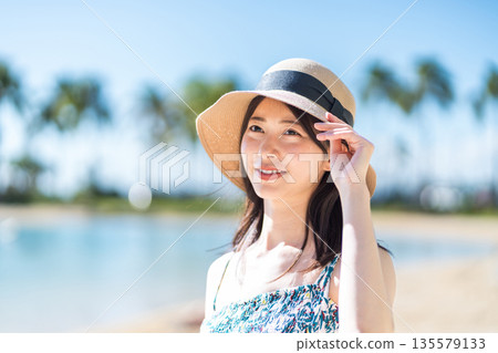 A young woman on vacation in a tropical country. 135579133