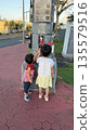 A child walking hand in hand 135579516