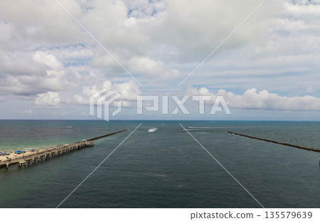 Panorama of Miami Beach with turquoise waters. Drone shot of Miami skyline. Top view of South Beach. Miami cityscape with luxury skyscrapers and ocean. View of Miami famous coastline. 135579639