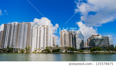 Famous landmarks of Miami Brickell from above. Drone view of the Brickell in Miami city. Business in Brickell district. Biscayne Bay Florida iconic urban coastline in daylight. 135579675