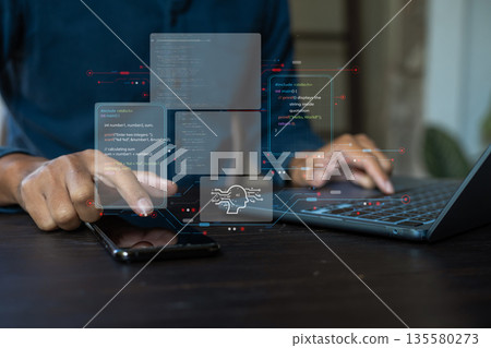 Businessman using a smartphone and laptop computer chatting with an intelligent artificial intelligence. 135580273