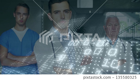Standing medical team crossing arms in hospital corridor, with stethoscopes and binary data overlay Standing medical team crossing arms in hospital corridor, with stethoscopes and binary data overlay 135580325