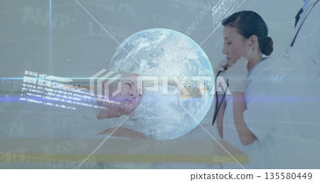 Examining lab-coated doctor using stethoscope on patient chest in exam room, with holographic globe Examining lab-coated doctor using stethoscope on patient chest in exam room, with holographic globe 135580449
