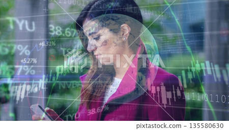 Analyzing woman in magenta coat checking smartphone on city street, with financial charts Analyzing woman in magenta coat checking smartphone on city street, with financial charts 135580630
