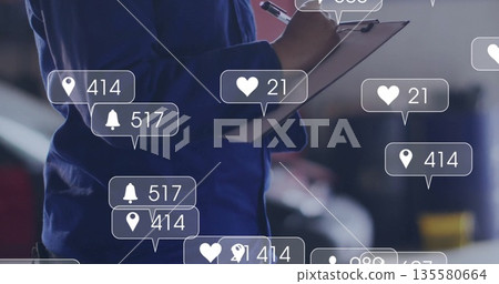 Female tech wearing coveralls inspecting vehicle in garage with clipboard, pen and digital icons 135580664