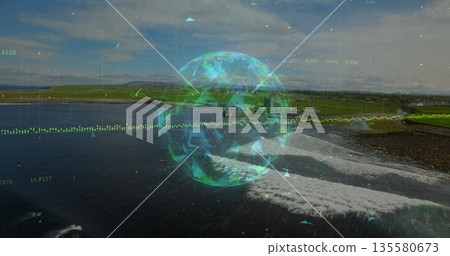 Displaying globe hologram at coastal shoreline, with numeric overlays and triangular particles 135580673