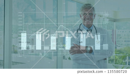 Standing doctor crossing arms behind digital charts in clinic, with stethoscope, watch, copy space Standing doctor crossing arms behind digital charts in clinic, with stethoscope, watch, copy space 135580720
