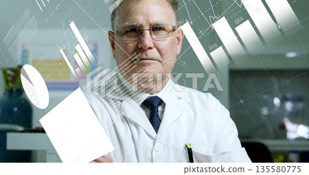 Analyzing holographic charts, senior scientist in lab coat and tie holding display panel in lab Analyzing holographic charts, senior scientist in lab coat and tie holding display panel in lab 135580775