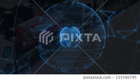 Floating holographic globe displaying digital network nodes in tech lab, with wireframe connections 135580795